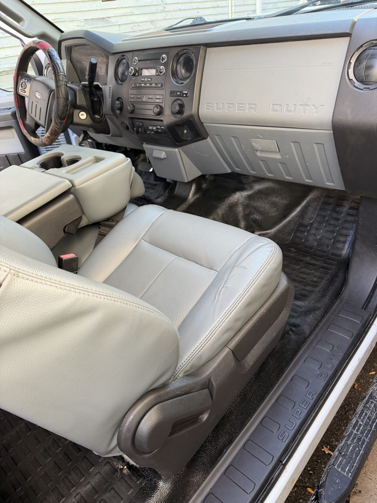 After: clean passenger floor mat, seat, dash, and door sill