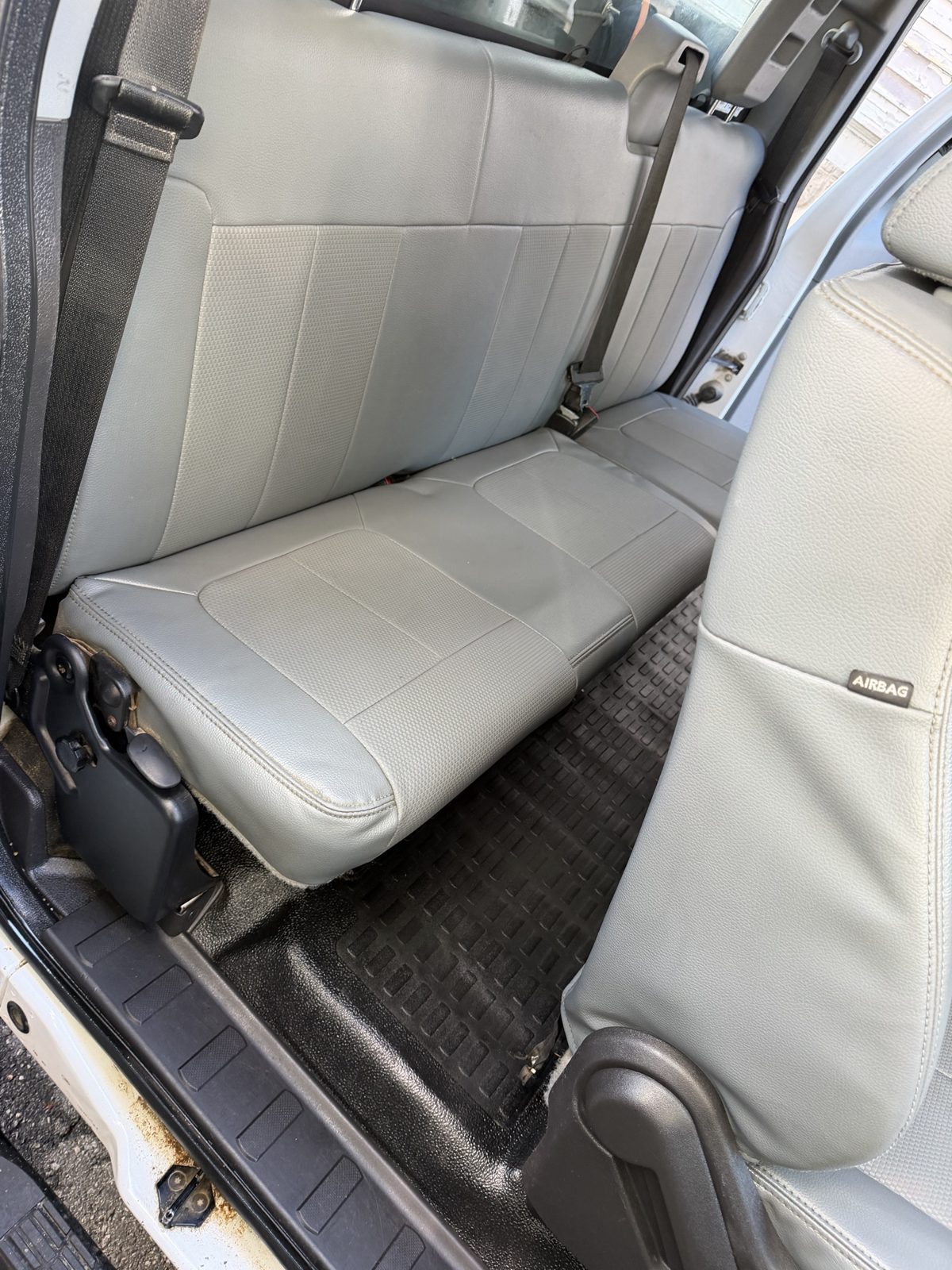 After: clean rear bench seat and floor mat