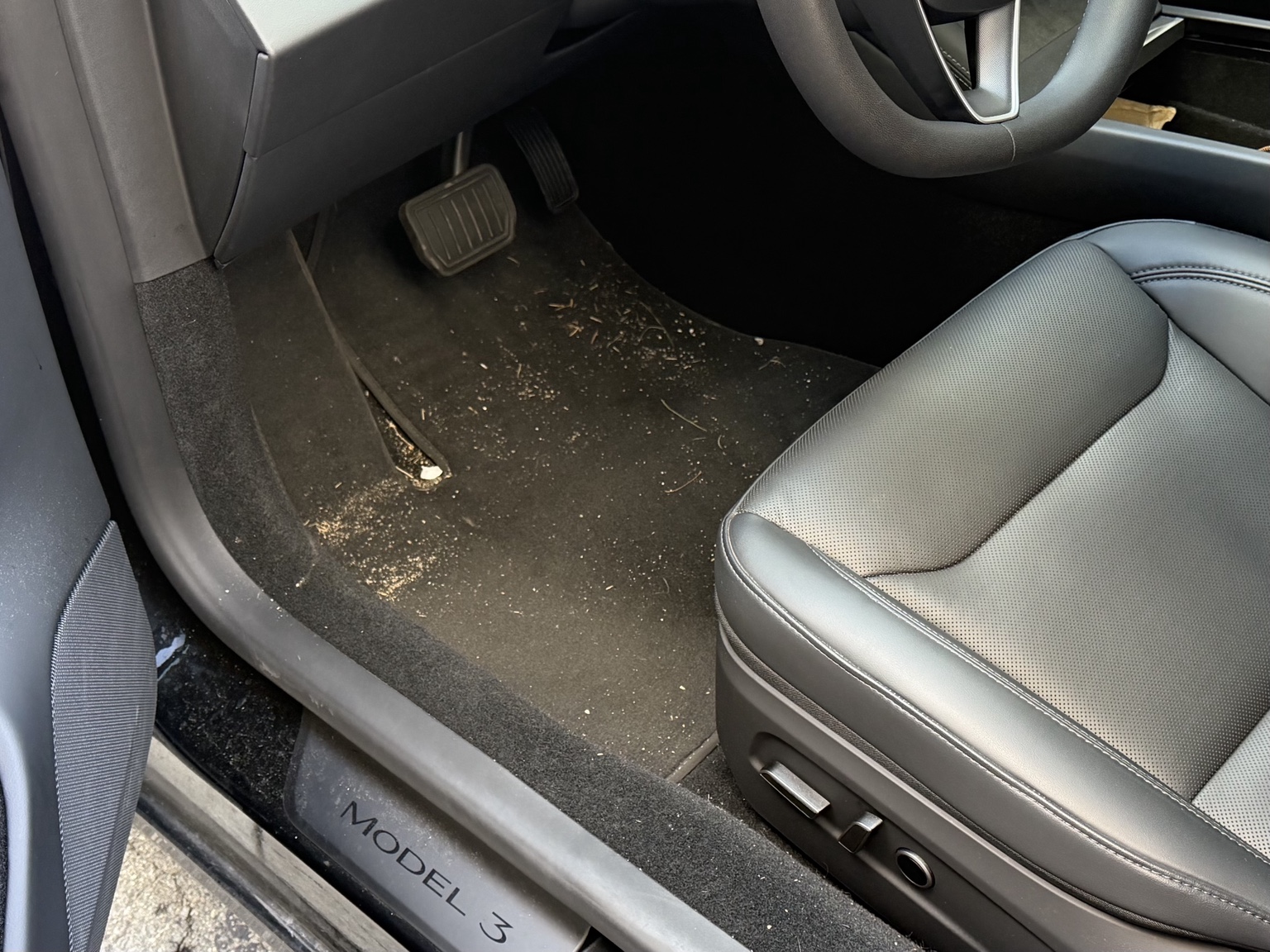 Before detailing: debris and dirt in the driver's footwell